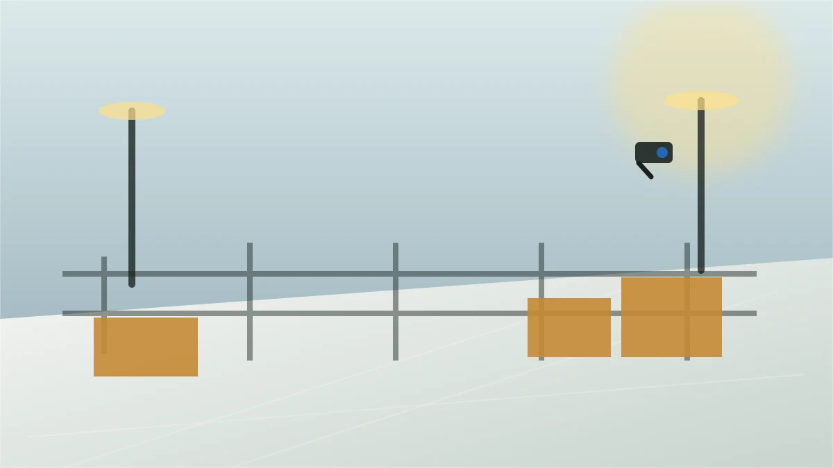 Outdoor yard perimeter with lighting poles, fencing, and security camera coverage